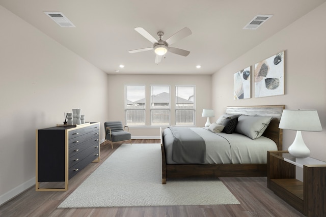 bedroom featuring dark hardwood / wood-style floors and ceiling fan