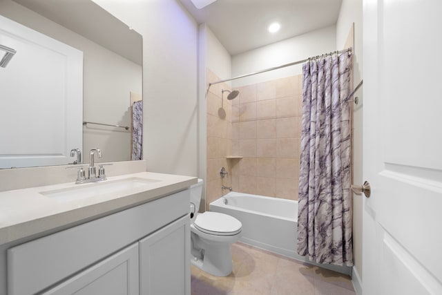 full bathroom featuring tile patterned floors, vanity, toilet, and shower / tub combo