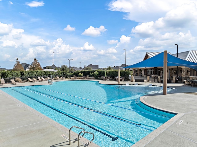 view of pool featuring a patio