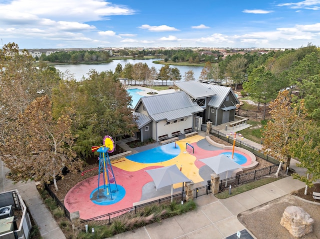 birds eye view of property with a water view