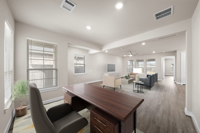 office with hardwood / wood-style flooring and ceiling fan