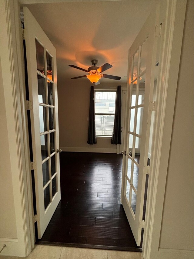 unfurnished room featuring ceiling fan, french doors, and hardwood / wood-style floors