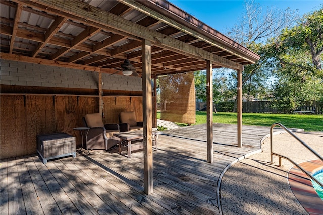 view of patio featuring ceiling fan and a deck