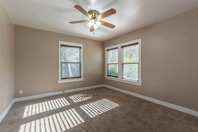 empty room featuring carpet flooring and ceiling fan