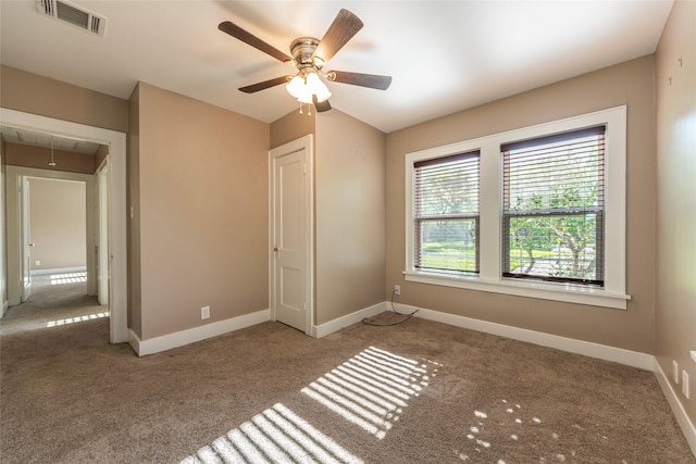 unfurnished bedroom with light colored carpet and ceiling fan