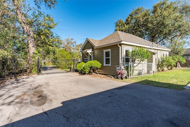 view of property exterior with a yard