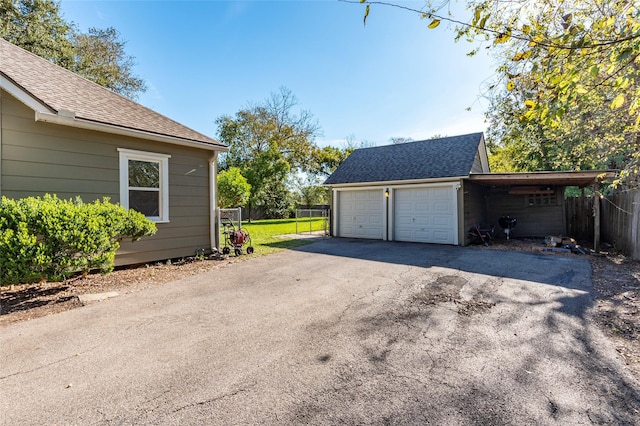 garage featuring a carport