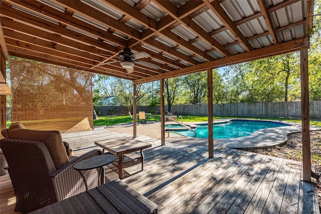 view of pool featuring ceiling fan and a deck