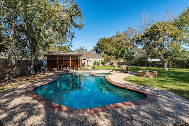 view of pool featuring a lawn, an in ground hot tub, and a patio