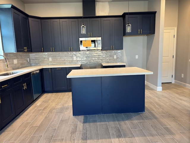 kitchen with sink, a center island, light wood-type flooring, and black dishwasher