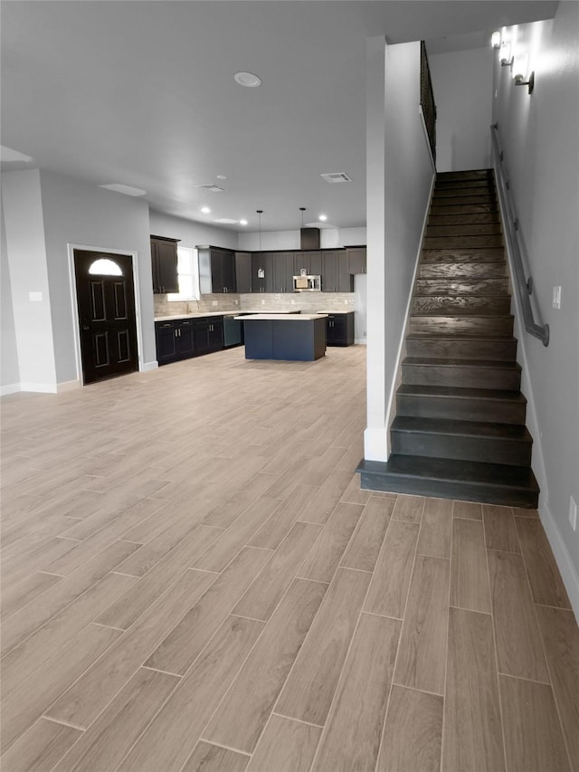 staircase featuring hardwood / wood-style floors