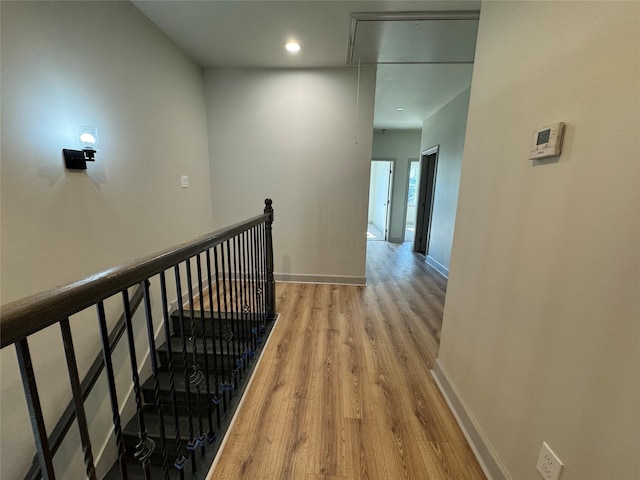 corridor with light hardwood / wood-style flooring