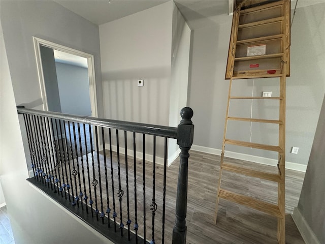 staircase featuring hardwood / wood-style flooring