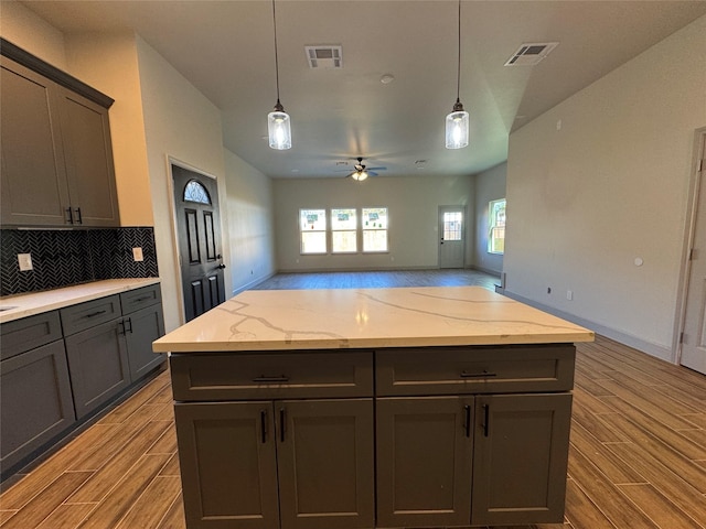 kitchen featuring light hardwood / wood-style floors, hanging light fixtures, and ceiling fan