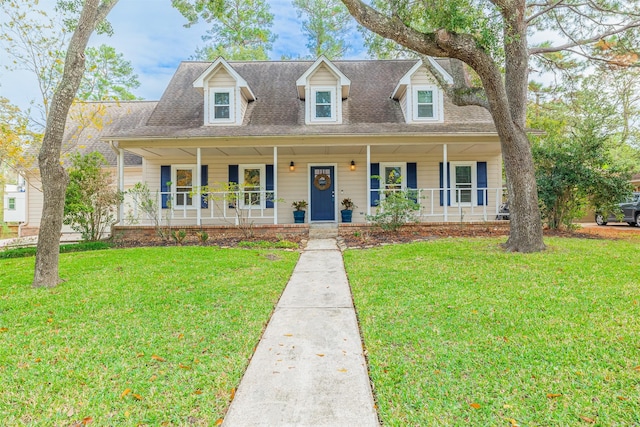 new england style home featuring a front lawn