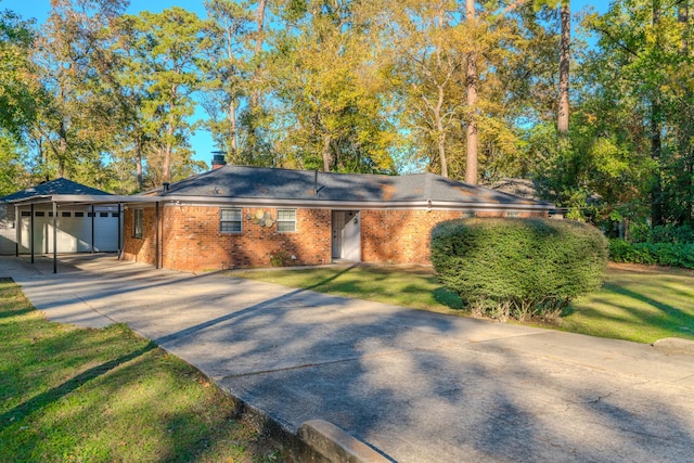 ranch-style home with a front lawn and a garage