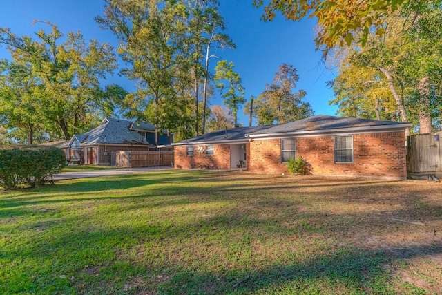 rear view of house with a lawn