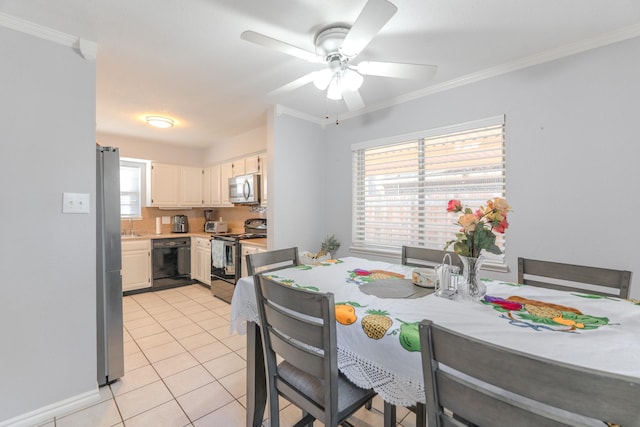 dining room featuring plenty of natural light, ceiling fan, and ornamental molding