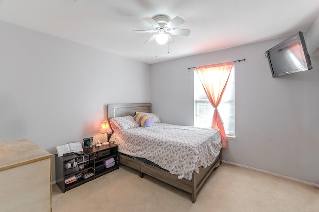 bedroom featuring ceiling fan and light colored carpet