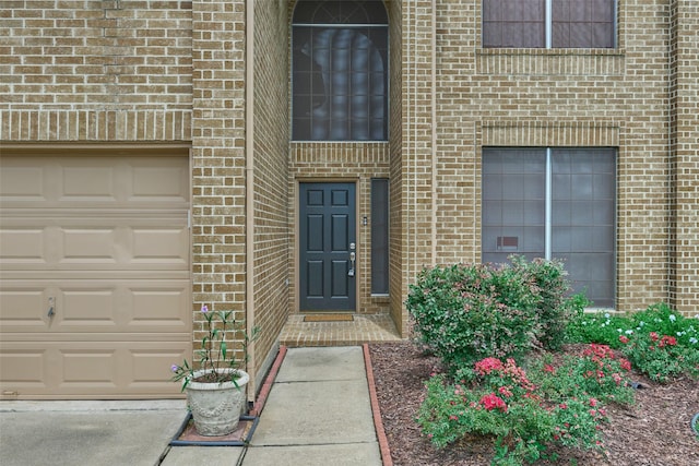 doorway to property featuring a garage