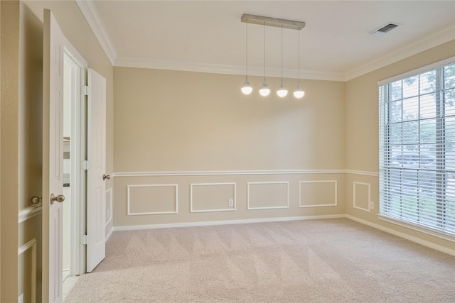 carpeted spare room with ornamental molding