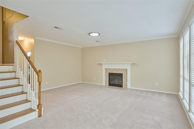 unfurnished living room with a fireplace, light colored carpet, and crown molding