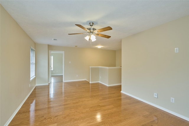 spare room with ceiling fan and light hardwood / wood-style floors