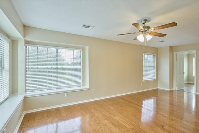 unfurnished room featuring ceiling fan and light wood-type flooring