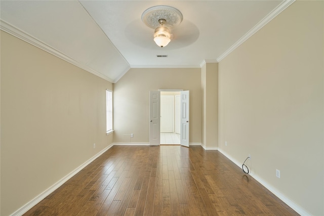 unfurnished room featuring dark hardwood / wood-style floors, ceiling fan, lofted ceiling, and crown molding