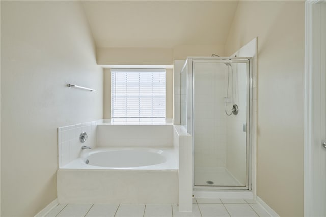 bathroom with separate shower and tub, tile patterned floors, and lofted ceiling