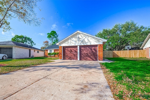 garage featuring a lawn