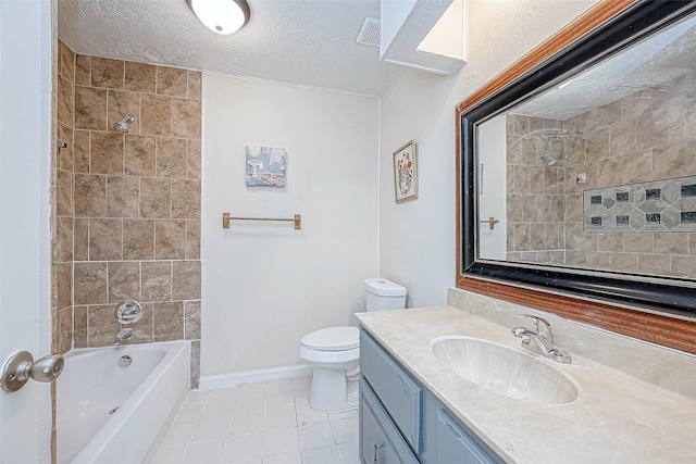 full bathroom with vanity, toilet, a textured ceiling, and tiled shower / bath