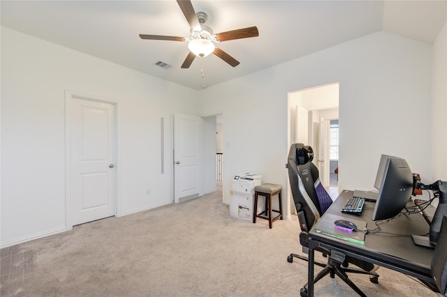 office area with ceiling fan, light colored carpet, and lofted ceiling