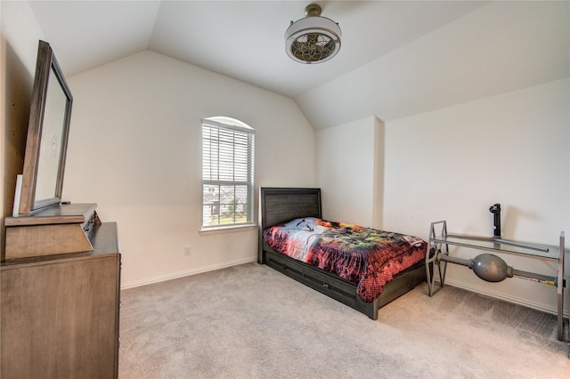 carpeted bedroom with lofted ceiling