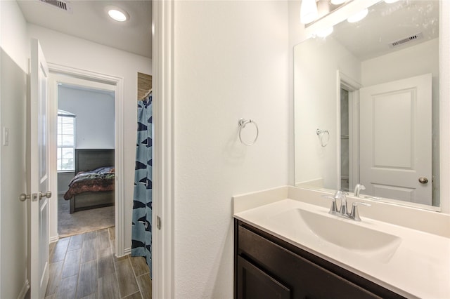 bathroom featuring hardwood / wood-style floors and vanity