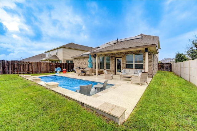 back of property with a lawn, a patio, an outdoor hangout area, and a fenced in pool