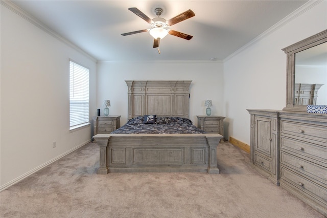 carpeted bedroom with ceiling fan and crown molding