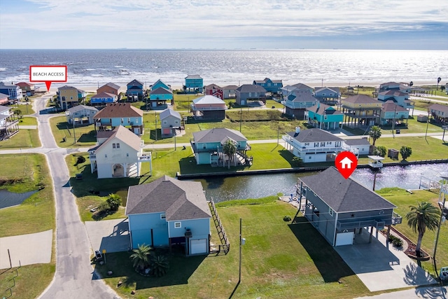 birds eye view of property featuring a water view