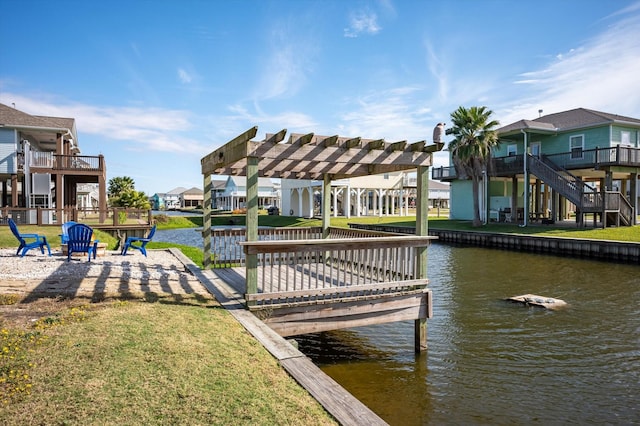 dock area featuring a water view, a pergola, and a yard