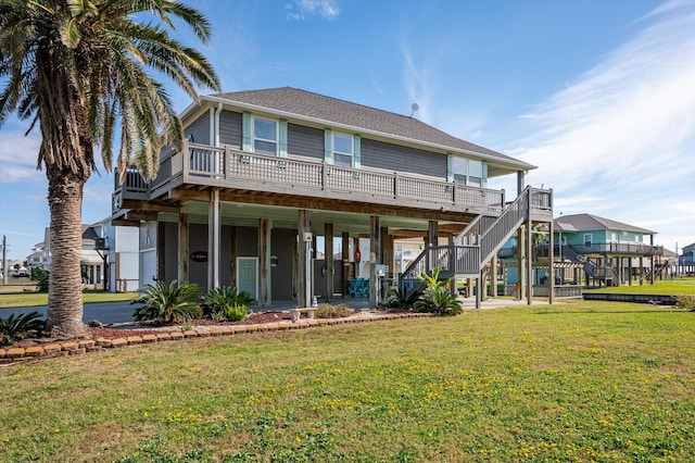 back of house with a lawn