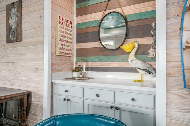 bathroom with wooden walls and vanity