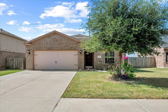 view of front of house featuring a front yard and a garage