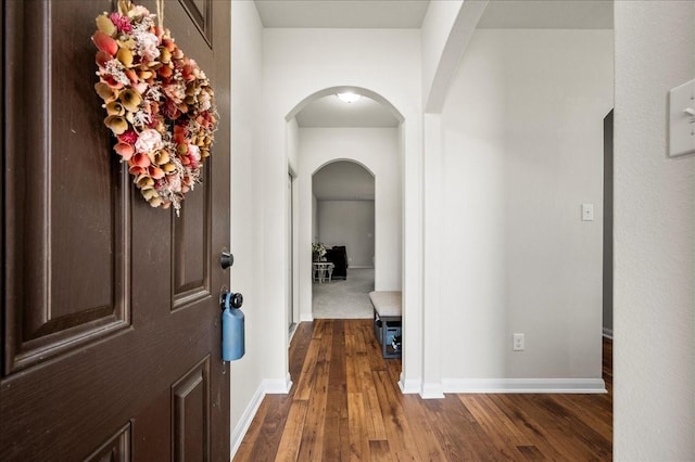 corridor with dark wood-type flooring