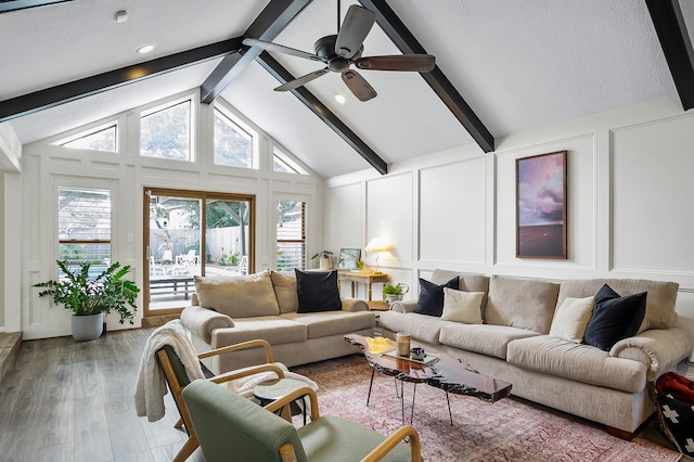 living room with hardwood / wood-style floors, ceiling fan, beam ceiling, and high vaulted ceiling