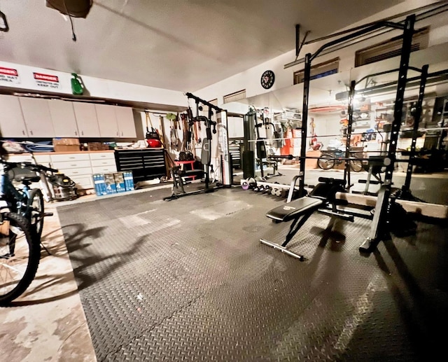 gym featuring a workshop area