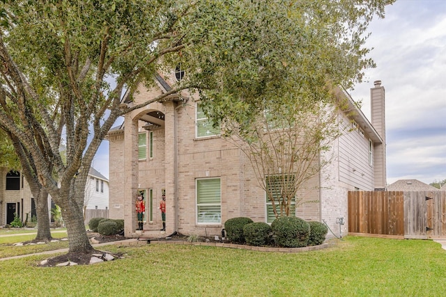 view of front of home with a front lawn