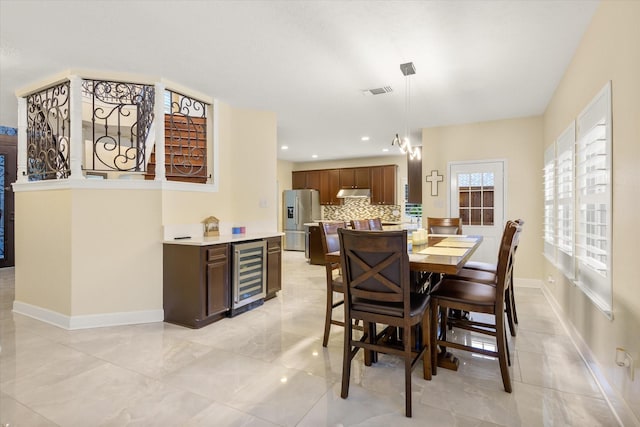 7411 Shady Arbour Ct, Pasadena, TX 77505 - dining room with wine cooler and recessed lighting