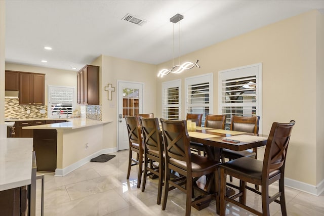 dining room featuring a chandelier