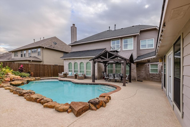 view of swimming pool featuring an outdoor living space and a patio area