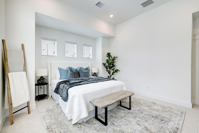 bedroom with light carpet